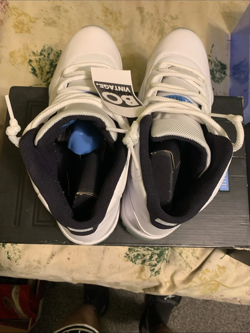 Jordan 11 men’s White High-Top Sneakers carolina blue